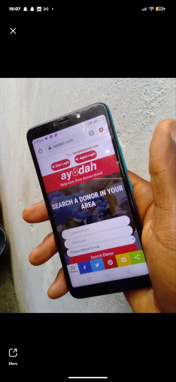 Ayodah mobile app search screen shown on a phone in hand.